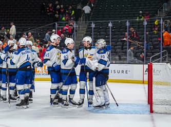 Colorado Eagles players celebrate their win with goalie Trent Miner after Game 1 of the Pacific Division Finals at Acrisure